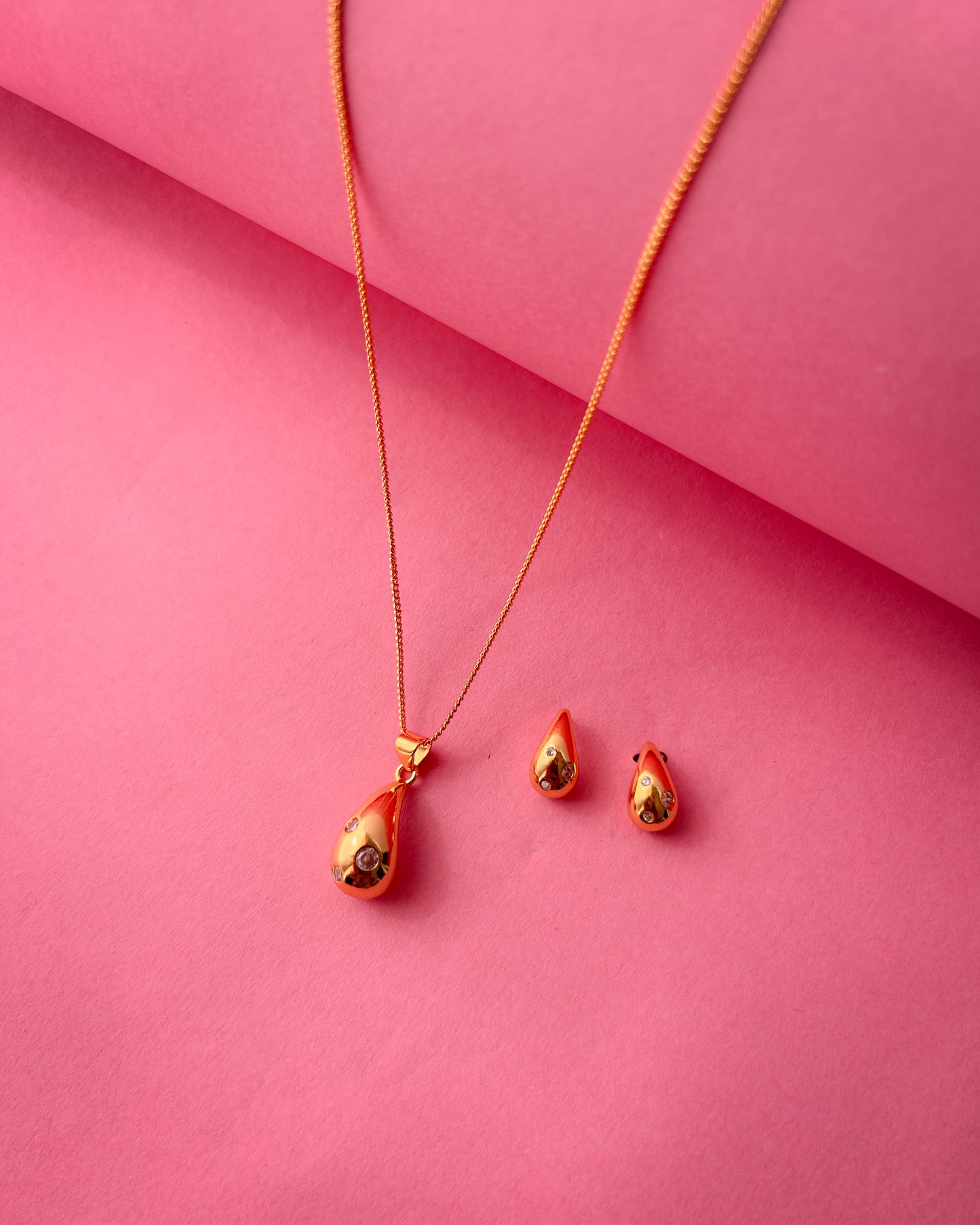 Gold Teardrop Pendant set with crystal accents