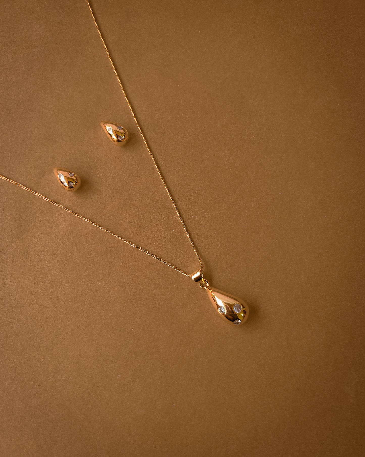 Gold Teardrop Pendant set with crystal accents