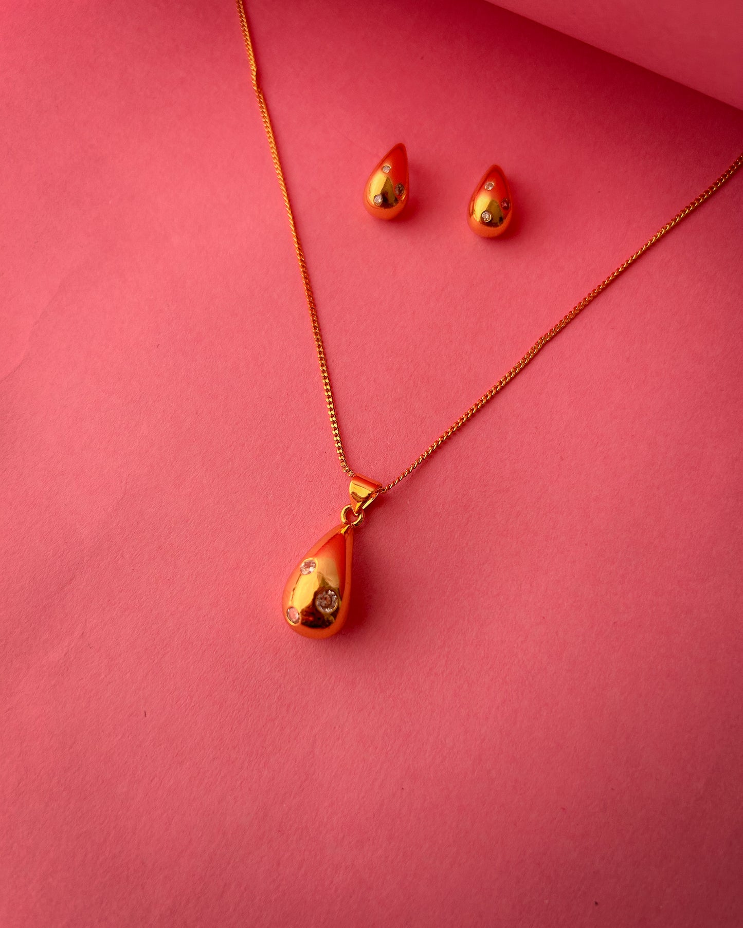 Gold Teardrop Pendant set with crystal accents